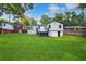 View of backyard with lush grass and home exterior at 1398 Woodland Ave, Atlanta, GA 30316