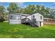 Backyard view of home exterior and lush green lawn at 1398 Woodland Ave, Atlanta, GA 30316
