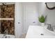 Bathroom with a tiled shower and mosaic tile accent at 1398 Woodland Ave, Atlanta, GA 30316