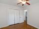 Bedroom with hardwood floors and closet with white bi-fold doors at 1398 Woodland Ave, Atlanta, GA 30316