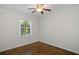 This cozy bedroom features a ceiling fan and hardwood flooring at 1398 Woodland Ave, Atlanta, GA 30316