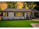 Well maintained front exterior of home with green lawn and professional landscaping at 1398 Woodland Ave, Atlanta, GA 30316