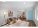 Open-concept living area flows into the dining space, bathed in natural light at 1398 Woodland Ave, Atlanta, GA 30316