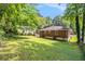 A well-maintained lawn and a classic, one story brick house exterior complete this home's backyard at 2329 Polar Rock Sw Ave, Atlanta, GA 30315