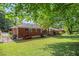 This backyard features a lush green lawn and charming brick house exterior at 2329 Polar Rock Sw Ave, Atlanta, GA 30315