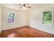 Bright bedroom with hardwood floors, a ceiling fan, and large windows offering natural light at 2329 Polar Rock Sw Ave, Atlanta, GA 30315