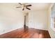 Comfortable bedroom with hardwood floors, ceiling fan, and a closet at 2329 Polar Rock Sw Ave, Atlanta, GA 30315