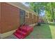 Brick house exterior with backyard access and a painted staircase at 2329 Polar Rock Sw Ave, Atlanta, GA 30315