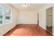 Bright living room featuring hardwood floors, neutral walls, ample windows, and an open doorway at 2329 Polar Rock Sw Ave, Atlanta, GA 30315