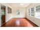 Bright living room featuring pristine hardwood floors, neutral walls, and ample natural light from large windows at 2329 Polar Rock Sw Ave, Atlanta, GA 30315