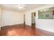 Open-concept living space with hardwood floors, neutral paint, and views into adjacent kitchen at 2329 Polar Rock Sw Ave, Atlanta, GA 30315