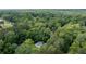 Aerial view of home surrounded by lush greenery and mature trees offering a private, secluded setting at 2343 Dawn Dr, Decatur, GA 30032