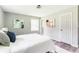 Serene bedroom with neutral walls, a white bed, and wood floors providing a peaceful retreat at 2343 Dawn Dr, Decatur, GA 30032