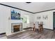 Dining room area with fireplace, light wood paneling and seating for four at 2343 Dawn Dr, Decatur, GA 30032
