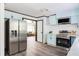 Updated kitchen with stainless steel appliances and view into living room at 2343 Dawn Dr, Decatur, GA 30032