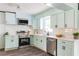 Modern kitchen featuring stainless steel appliances, light blue cabinets, and marble countertops at 2343 Dawn Dr, Decatur, GA 30032