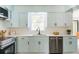Bright kitchen with white countertops, stainless steel appliances and light blue cabinets at 2343 Dawn Dr, Decatur, GA 30032