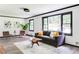Comfortable living room with a sofa, large windows offering plenty of natural light, and contemporary décor at 2343 Dawn Dr, Decatur, GA 30032