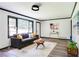 Bright living room with large window, gray sofa, and modern decor at 2343 Dawn Dr, Decatur, GA 30032