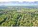 Expansive aerial view showcasing the lush green landscape surrounding the neighborhood at 2717 Hearthstone Cir, Marietta, GA 30062