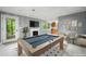 Finished basement with a billiards table, fireplace and chairs; ready for entertaining at 2717 Hearthstone Cir, Marietta, GA 30062