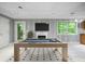 Finished basement with a billiards table and fireplace; ready for entertaining at 2717 Hearthstone Cir, Marietta, GA 30062