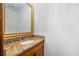 Charming powder room features a granite countertop and ornate mirror, adding a touch of elegance at 2717 Hearthstone Cir, Marietta, GA 30062