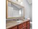 This bathroom features a granite vanity and framed mirror at 2717 Hearthstone Cir, Marietta, GA 30062