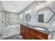 A bathroom with double sinks, marble countertops, modern fixtures, and a luxurious shower at 2717 Hearthstone Cir, Marietta, GA 30062