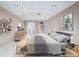 Staged bedroom with neutral color palette, tiled floor, and recessed lighting at 2717 Hearthstone Cir, Marietta, GA 30062