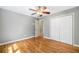 This bedroom features gleaming hardwood floors and double door closet at 2717 Hearthstone Cir, Marietta, GA 30062