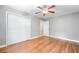 This bedroom features gleaming hardwood floors and a double-door closet at 2717 Hearthstone Cir, Marietta, GA 30062