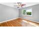 This spacious bedroom features gleaming hardwood floors and a bright window at 2717 Hearthstone Cir, Marietta, GA 30062