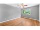This spacious bedroom features gleaming hardwood floors and a bright window at 2717 Hearthstone Cir, Marietta, GA 30062