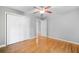 Neutral bedroom with hardwood floors, double closet, and access to adjacent rooms at 2717 Hearthstone Cir, Marietta, GA 30062