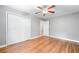 Bedroom with hardwood floors, ceiling fan, closet space and an ensuite entrance at 2717 Hearthstone Cir, Marietta, GA 30062