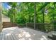 Spacious wooden deck perfect for outdoor entertaining, surrounded by a lush, green landscape at 2717 Hearthstone Cir, Marietta, GA 30062