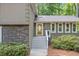 Charming home featuring stone accents and a walkway leading to the front door at 2717 Hearthstone Cir, Marietta, GA 30062