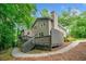Exterior view of a two-story home with a chimney, wood deck, and surrounding trees at 2717 Hearthstone Cir, Marietta, GA 30062