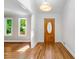 Inviting foyer with hardwood floors, a stylish light fixture, and a view into the adjacent living spaces at 2717 Hearthstone Cir, Marietta, GA 30062