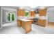 Bright kitchen features skylight, white counter tops, stainless steel appliances, and marble backsplash at 2717 Hearthstone Cir, Marietta, GA 30062