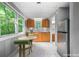 Eat-in kitchen offering stainless steel appliances, wood cabinets and a view of the backyard at 2717 Hearthstone Cir, Marietta, GA 30062