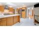 Bright kitchen with stainless steel appliances, island and ample storage, and adjacent staircase at 2717 Hearthstone Cir, Marietta, GA 30062