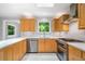 Modern kitchen with stainless steel appliances, white countertops, wooden cabinets and white backsplash tiles at 2717 Hearthstone Cir, Marietta, GA 30062