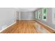 Spacious living room with hardwood floors, neutral walls, and ample natural light from the numerous windows at 2717 Hearthstone Cir, Marietta, GA 30062