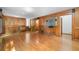 Unique living room with hardwood floors and wood panels, and stairs leading to second level at 2717 Hearthstone Cir, Marietta, GA 30062