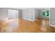Spacious living room with hardwood floors, bright natural light, and an adjacent dining room at 2717 Hearthstone Cir, Marietta, GA 30062