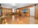 Spacious living room featuring wood paneling and hardwood floors at 2717 Hearthstone Cir, Marietta, GA 30062