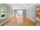 Open-concept living room featuring hardwood floors and views into the adjacent kitchen and foyer at 2717 Hearthstone Cir, Marietta, GA 30062