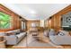 Inviting living room features wood paneling, built-in speakers, and stylish furnishings at 2717 Hearthstone Cir, Marietta, GA 30062